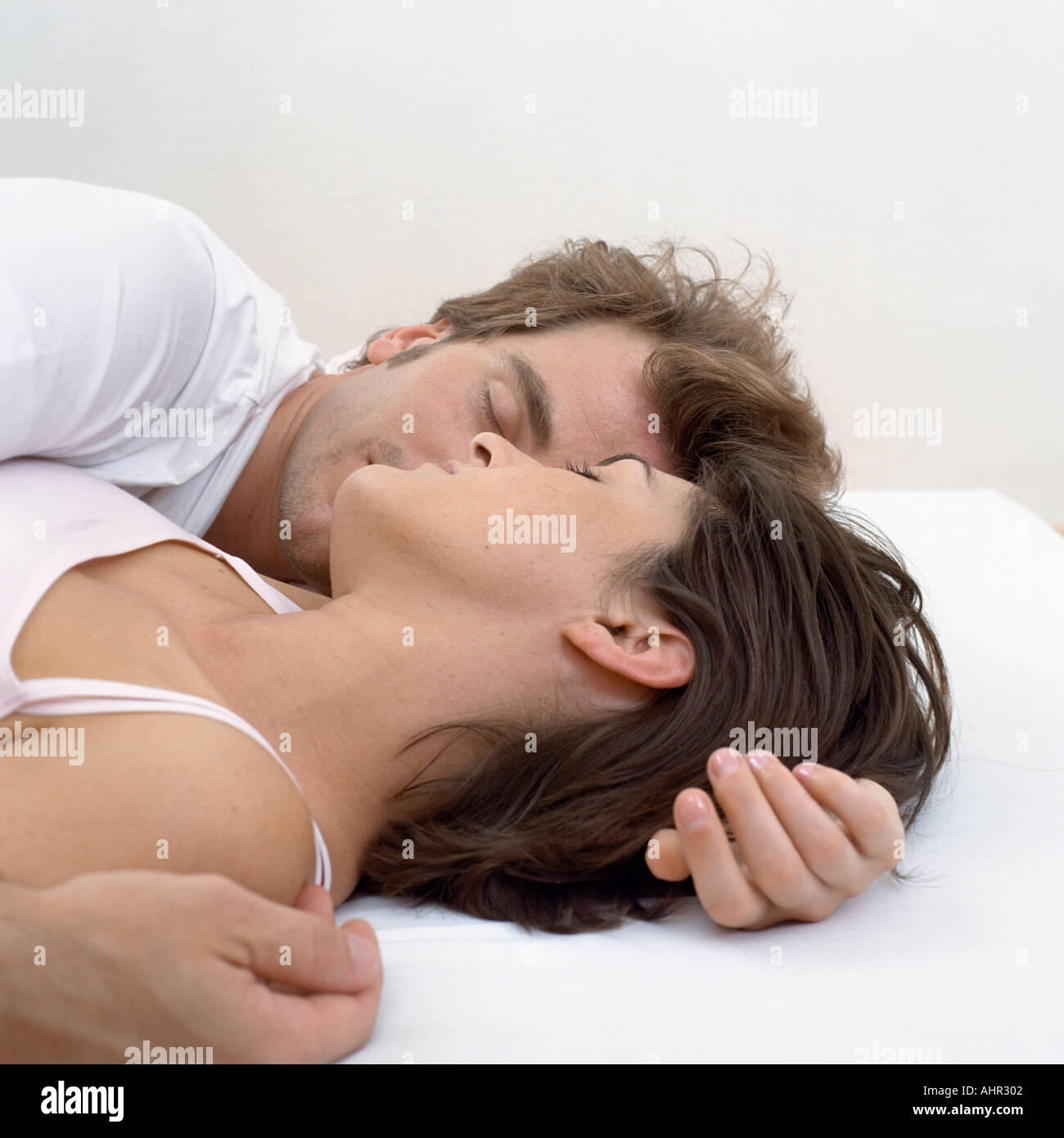 Couple asleep in bed Stock Photo