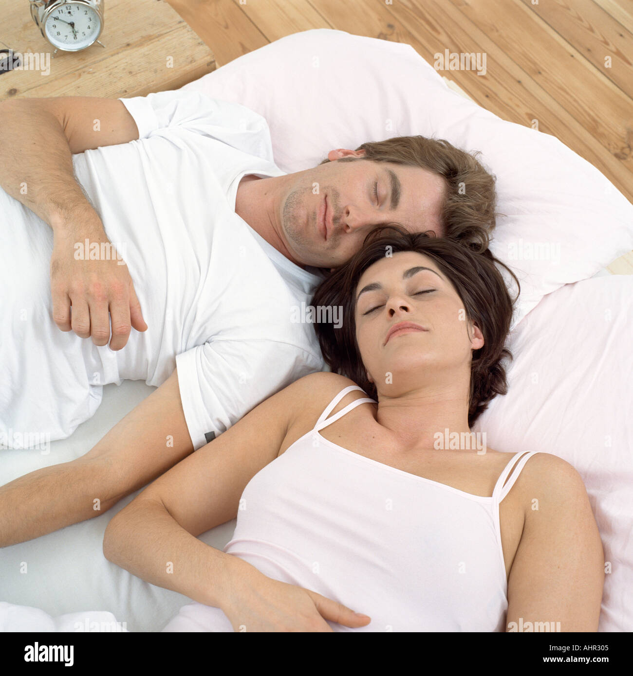 Close couple asleep in bed Stock Photo
