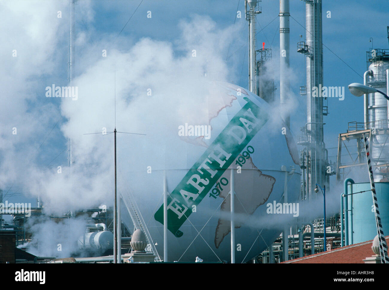 Earth day sign at an oil refinery Los Angeles CA Stock Photo