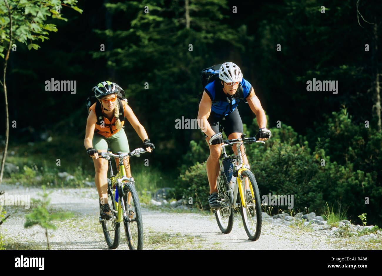 Man and woman cycling Stock Photo