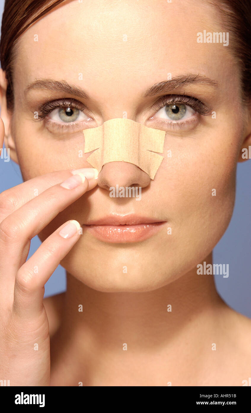 Woman wearing an adhesive plaster on face Stock Photo Alamy
