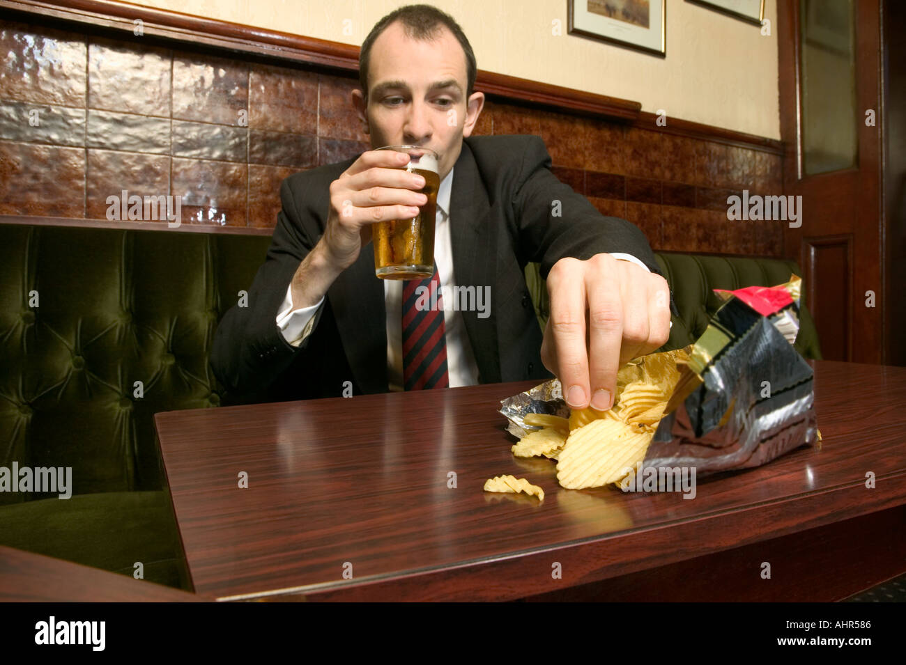 Businessman in a pub Stock Photo