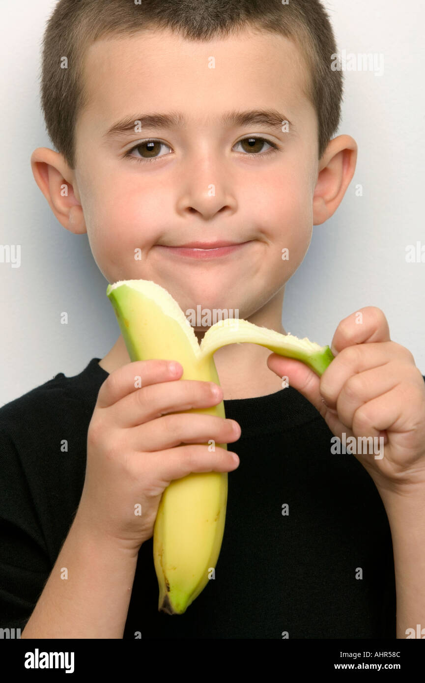 Child peeling a banana hires stock photography and images Alamy