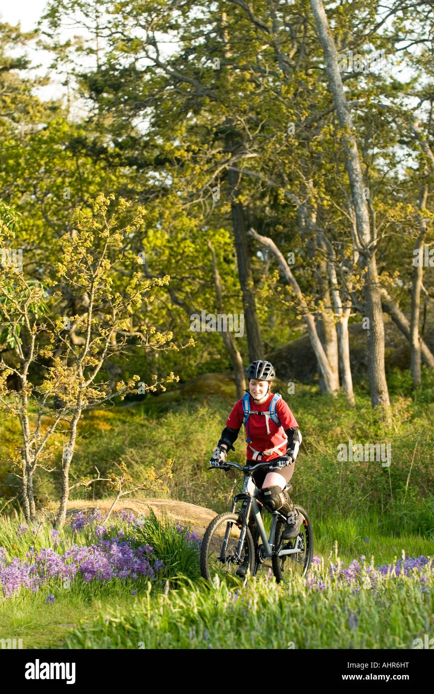A woman mountain biking in Highrock Park in Victoria BC Stock Photo Alamy