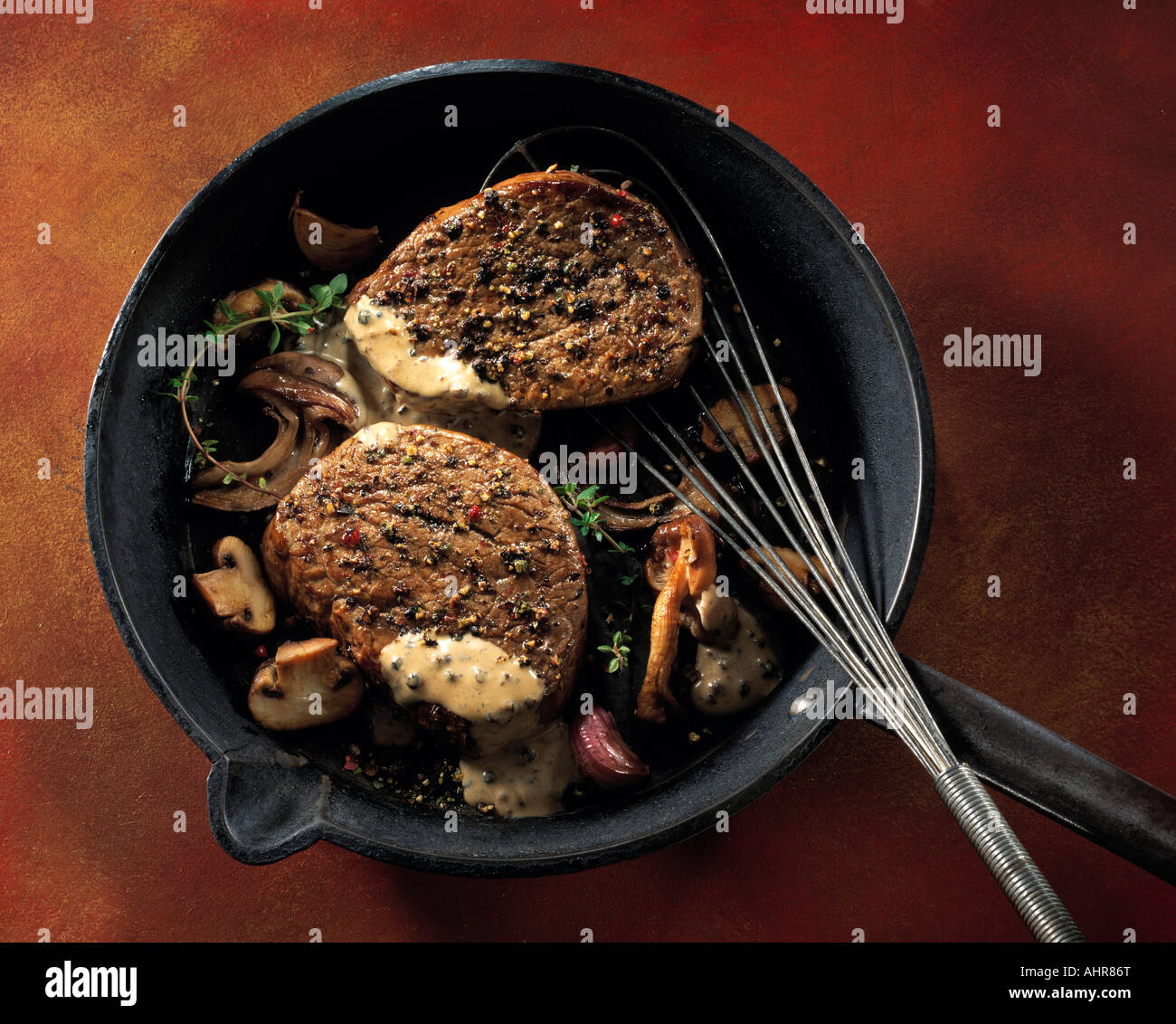 Pan fried fillet steak onions mushrooms peppercorn sauce hires stock