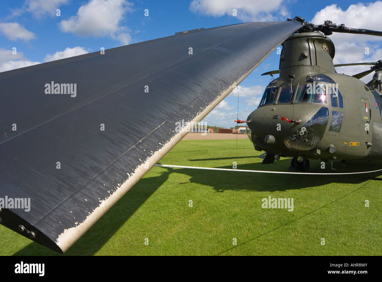 A Boeing CH 47 Chinook with the rotor blades all tied down and one of