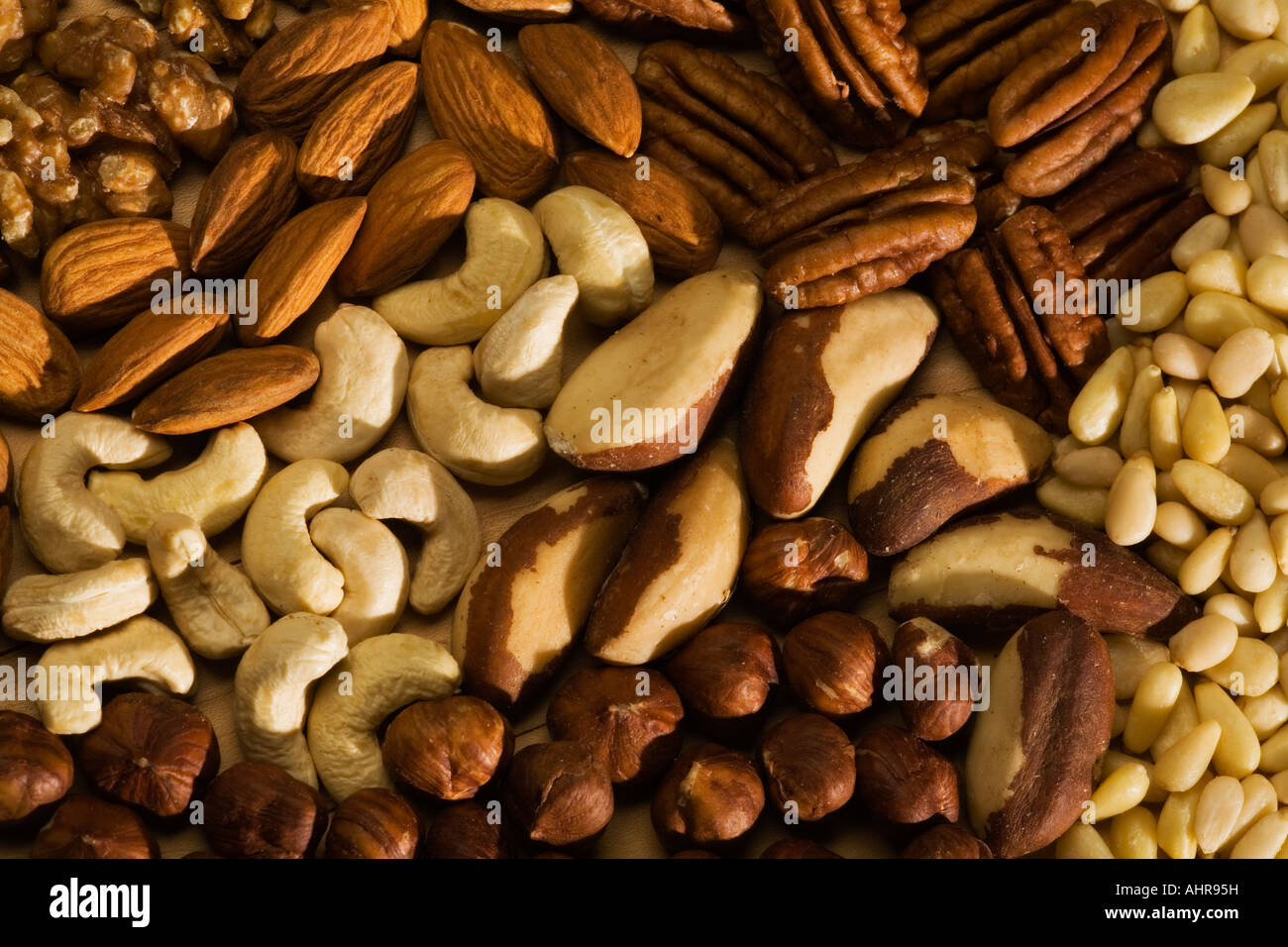 Mixed Nuts on a Chopping Board Stock Photo