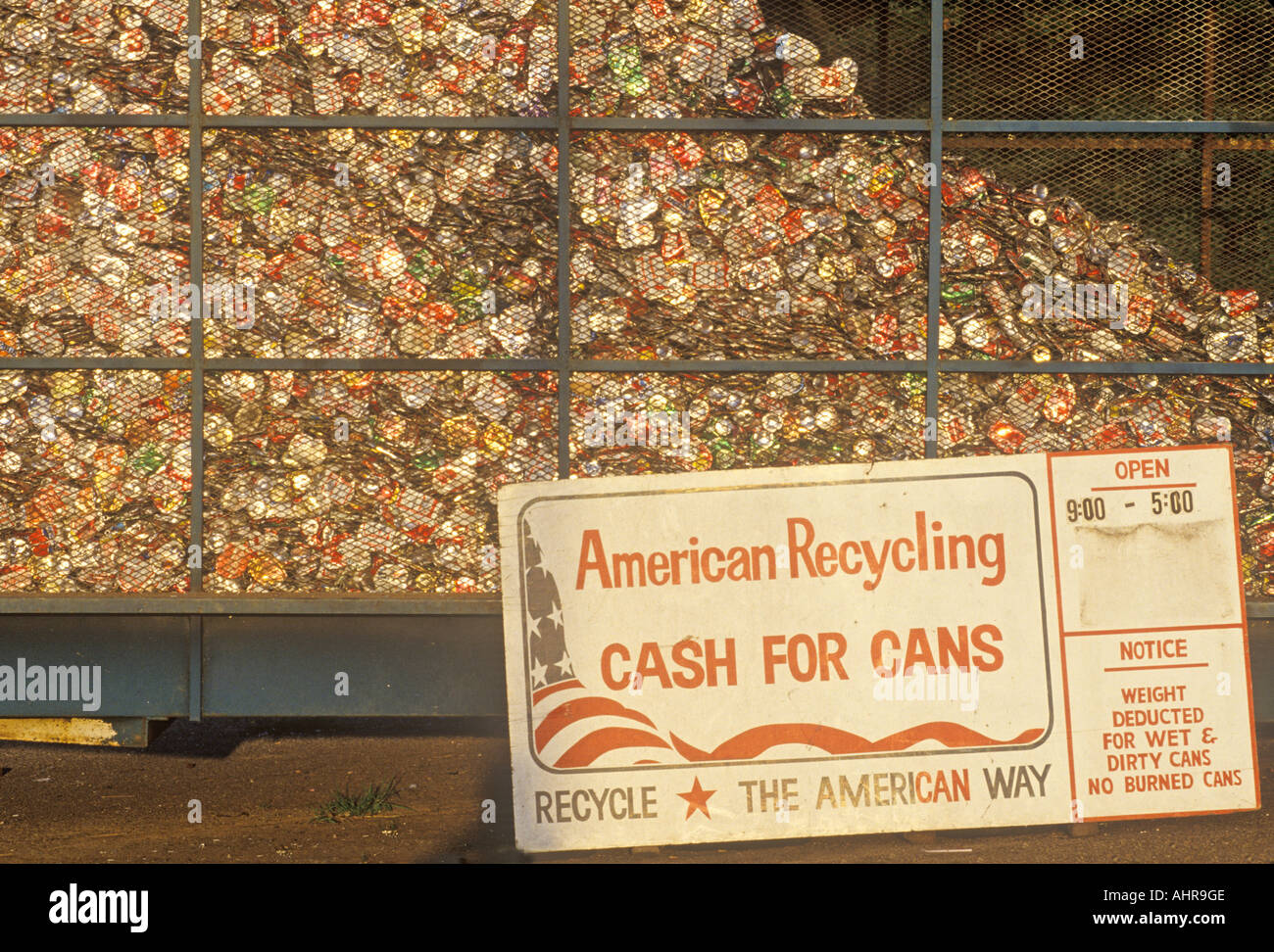 Recycling sign at can collecting site Stock Photo - Alamy