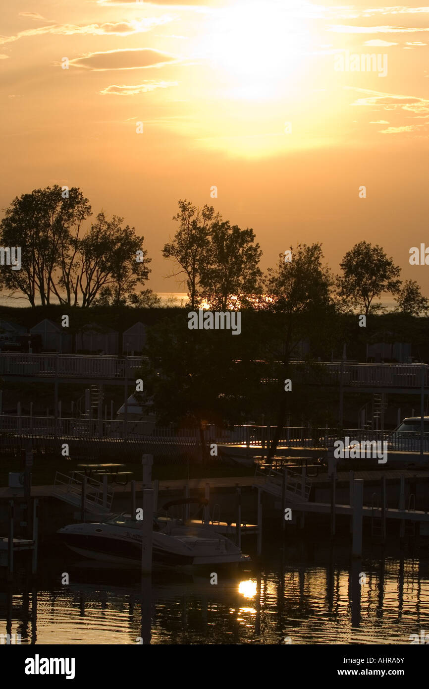 The transient public boat slip in New Buffalo Michigan with a setting sun in background Stock Photo