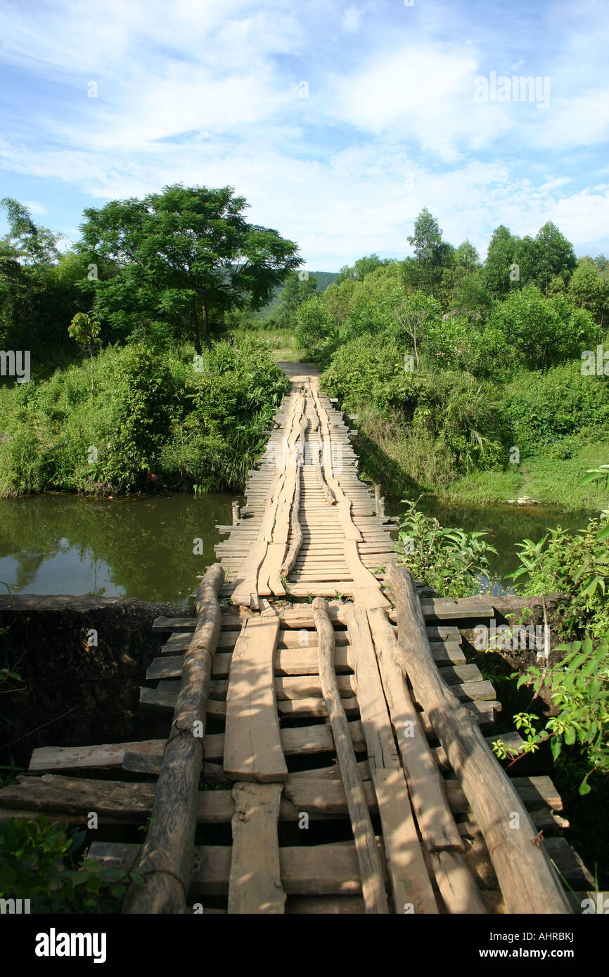 Wooden bridge across a river in Vietnam Stock Photo - Alamy