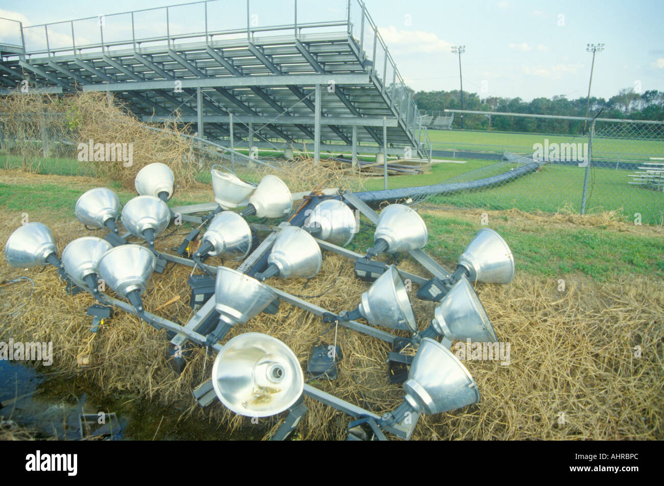 Light post lying on the ground after Hurricane Andrew has ripped it from its foundation at a football field in Jeanerette Stock Photo