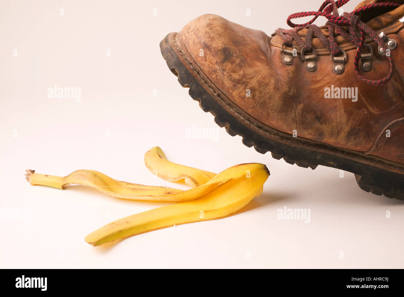 Shoe stepping on banana Stock Photo