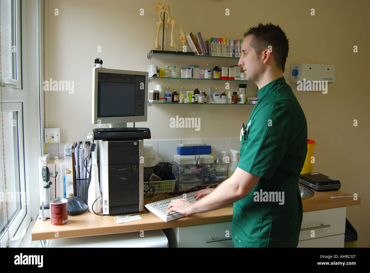 Male vet looking at computer in Veterinary Clinic, Sunninghill