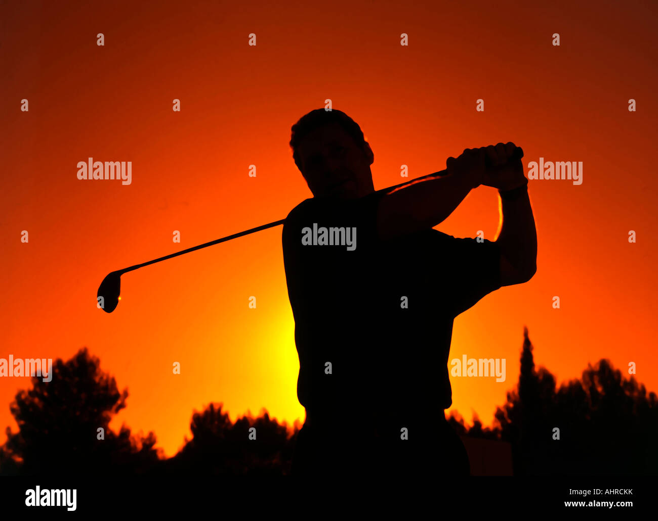 golf club swing tee sunset sport liesure Stock Photo