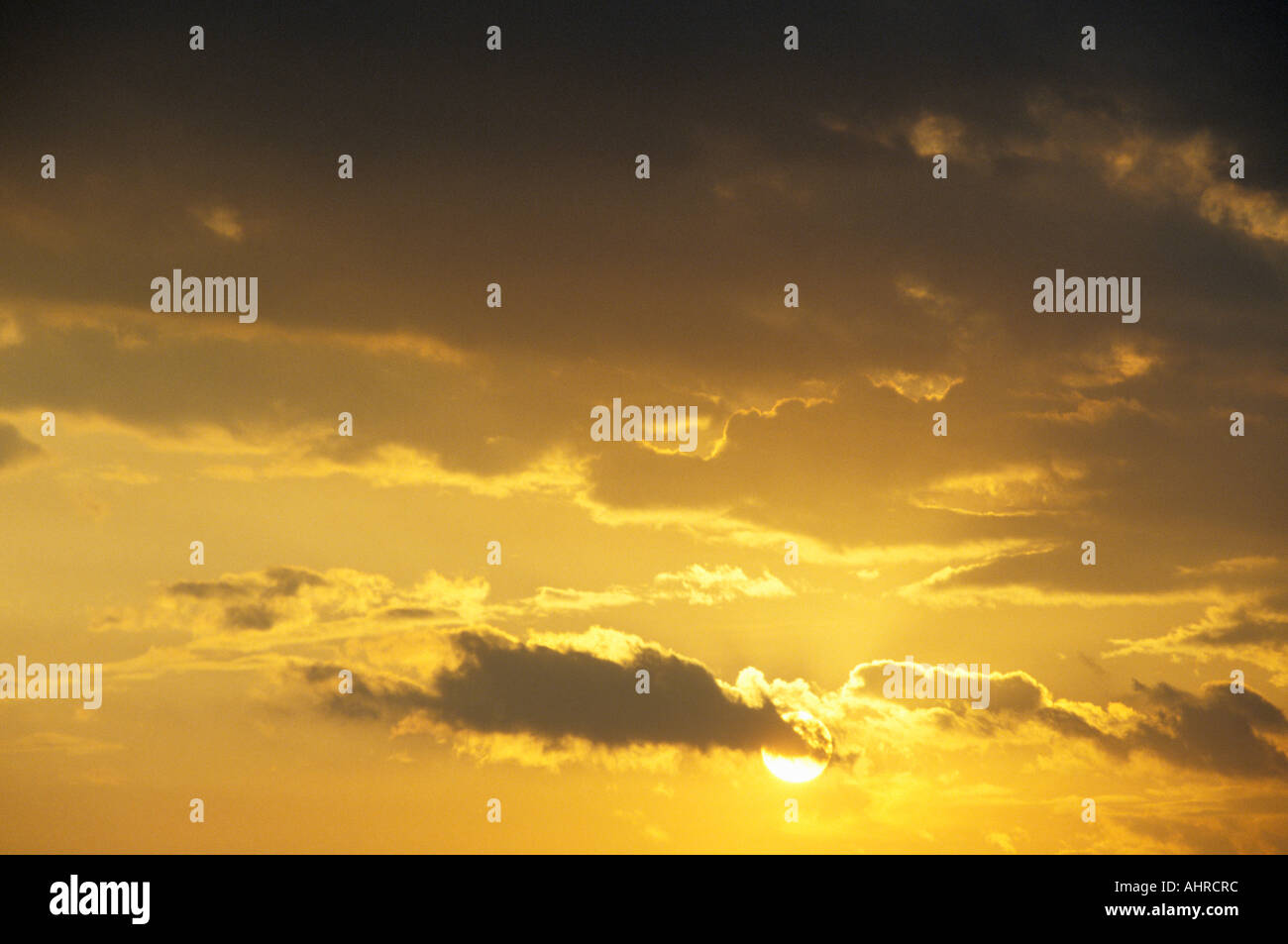 Sun in Cloudy Sky Stock Photo