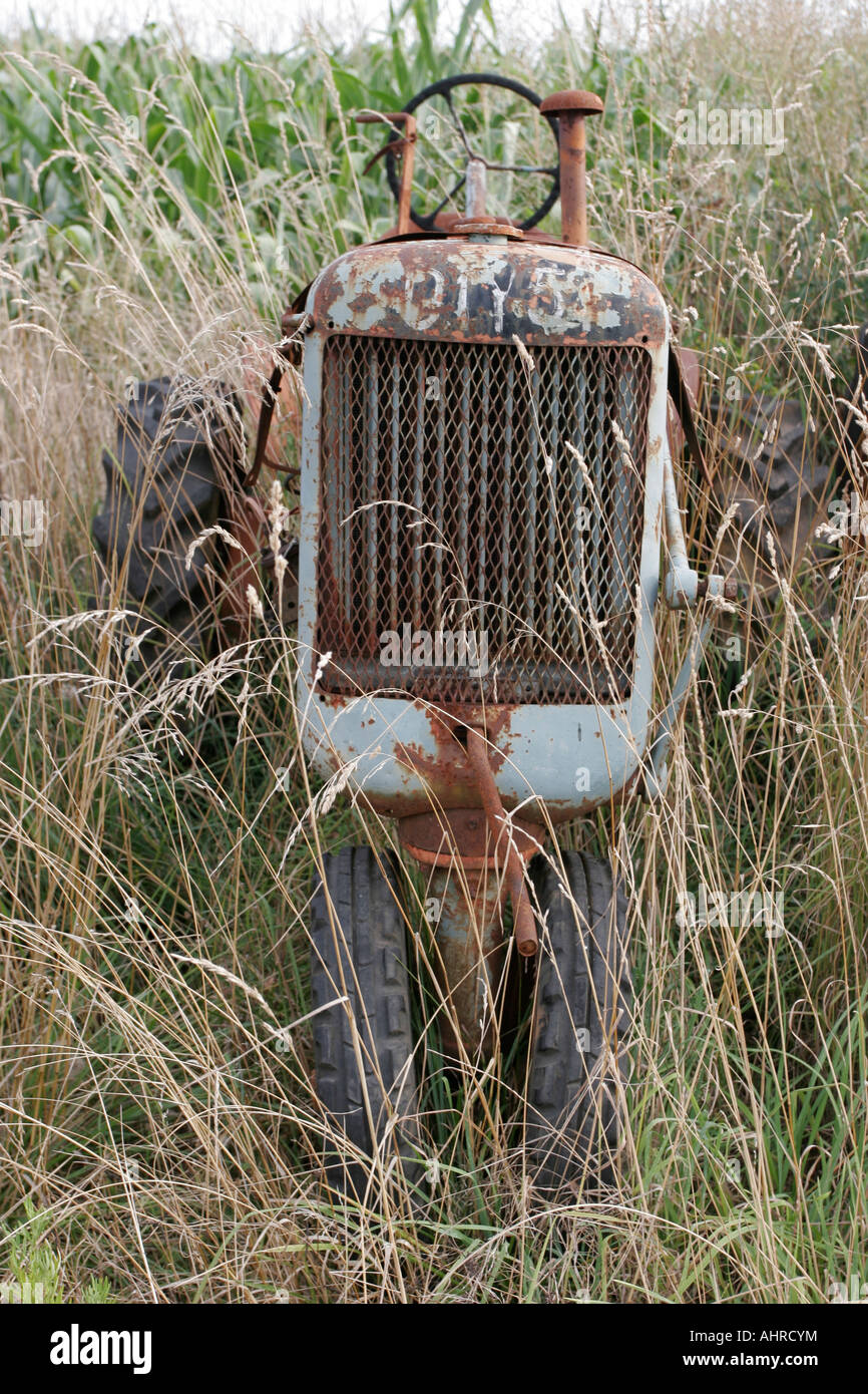 Old abandon grey farm tractor Stock Photo
