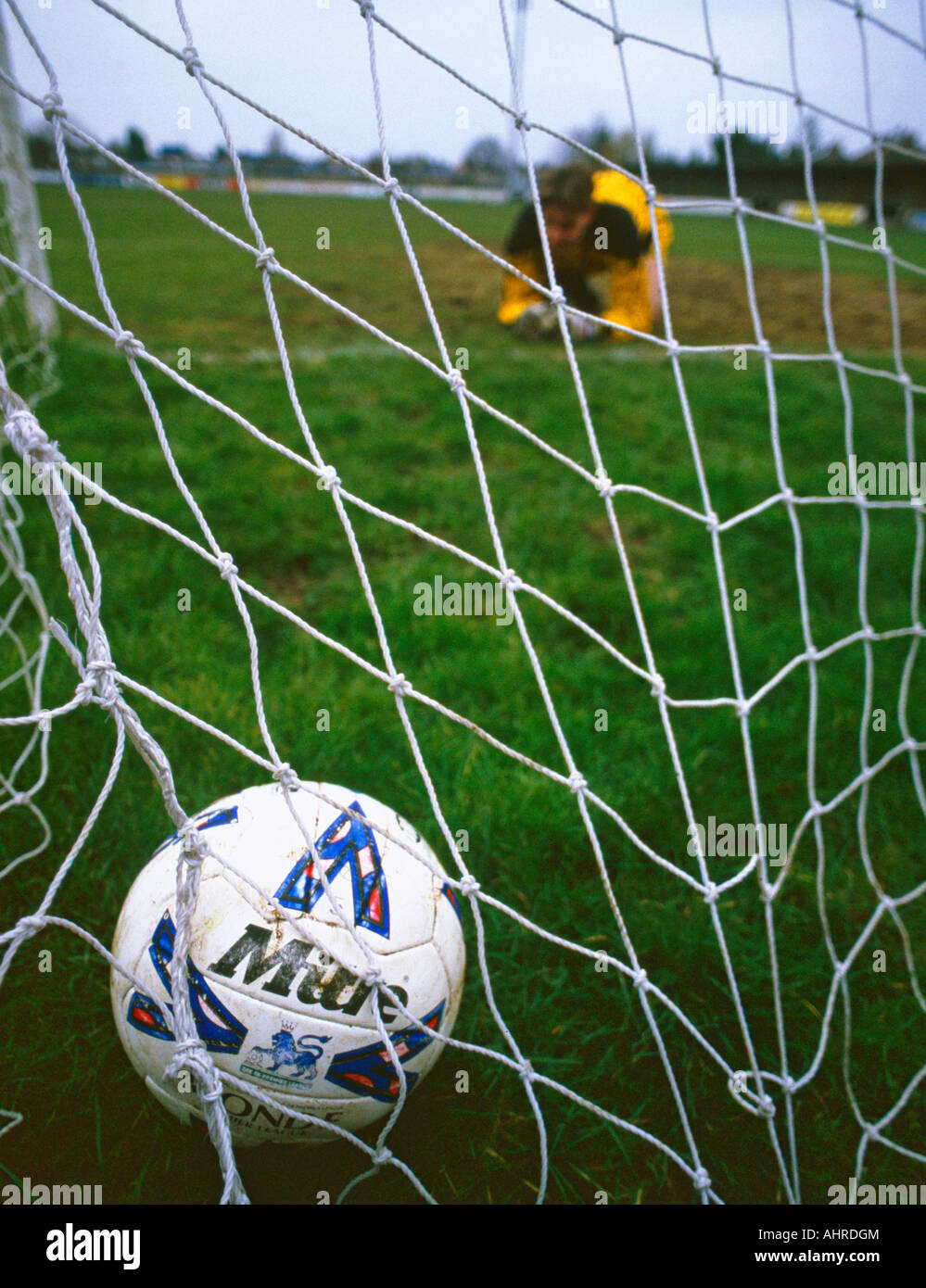 football dejected loser goal soccer disappointment upset net penalty Stock Photo