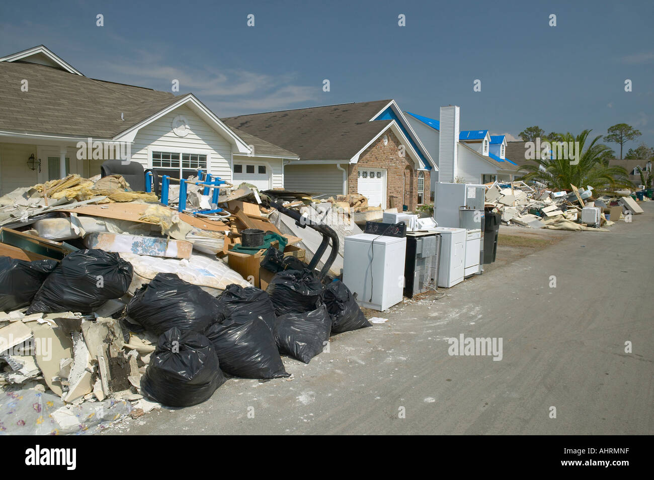 Row of suburban houses with debris after Hurricane Ivan in Pensacola Florida Stock Photo