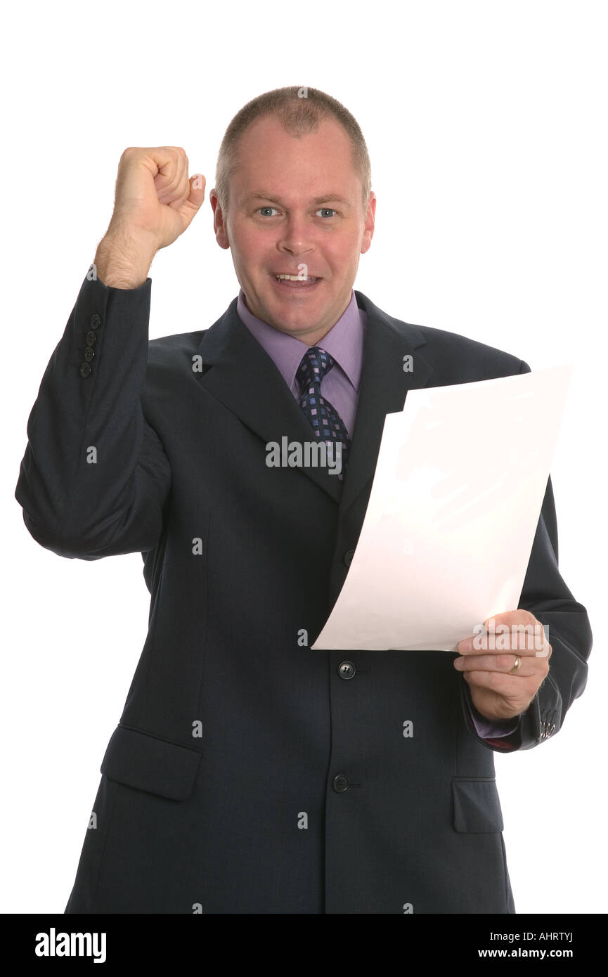 Successful businessman punching the air and holding a document Stock Photo
