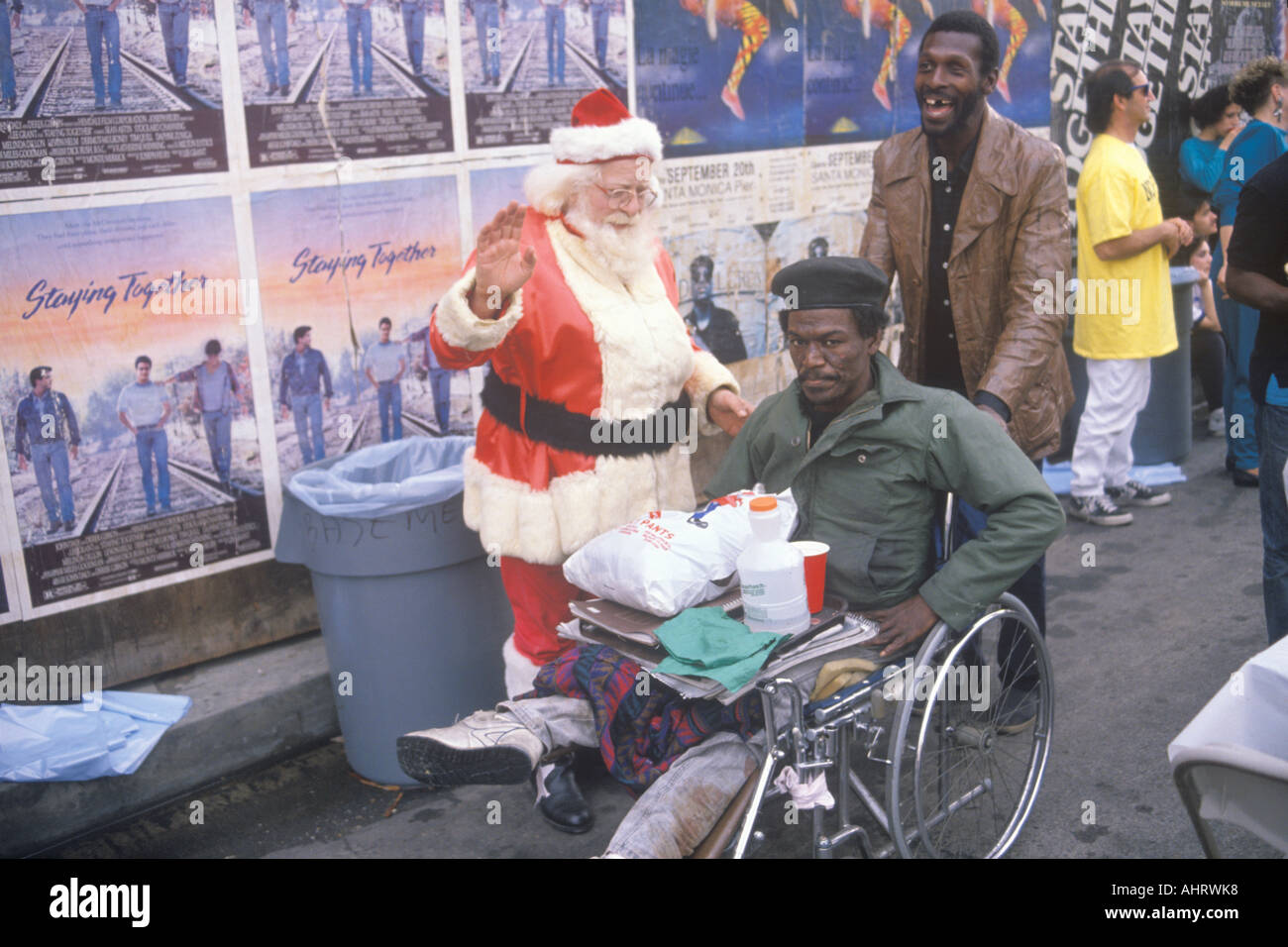 Santa Claus posing with homeless men for Christmas dinner Los Angeles