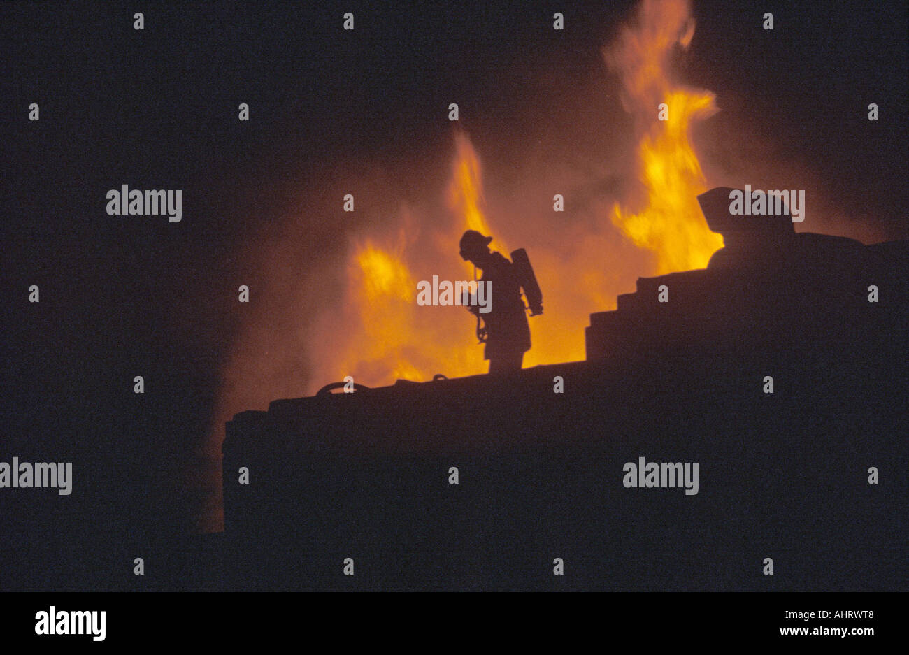 Silhouette of fireman in front of blaze Beverly Hills California Stock Photo