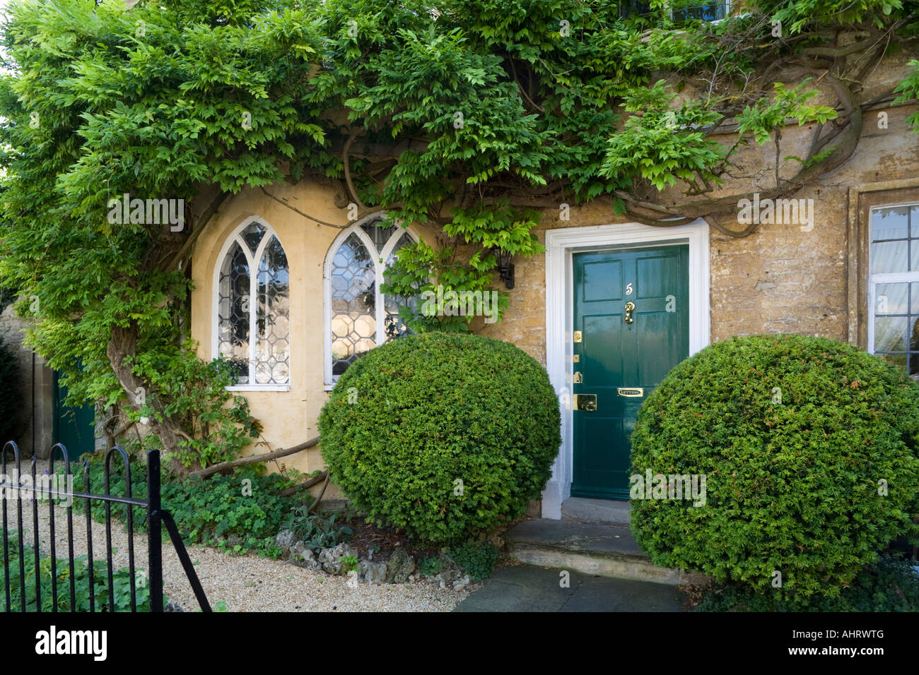 A creeper covered house in Cecily Hill in the Cotswold town of Cirencester, Gloucestershire UK Stock Photo