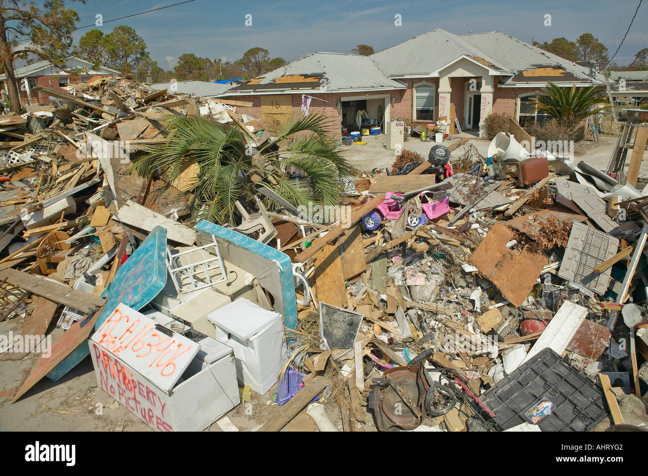 Debris in front of house heavily hit by Hurricane Ivan in Pensacola ...