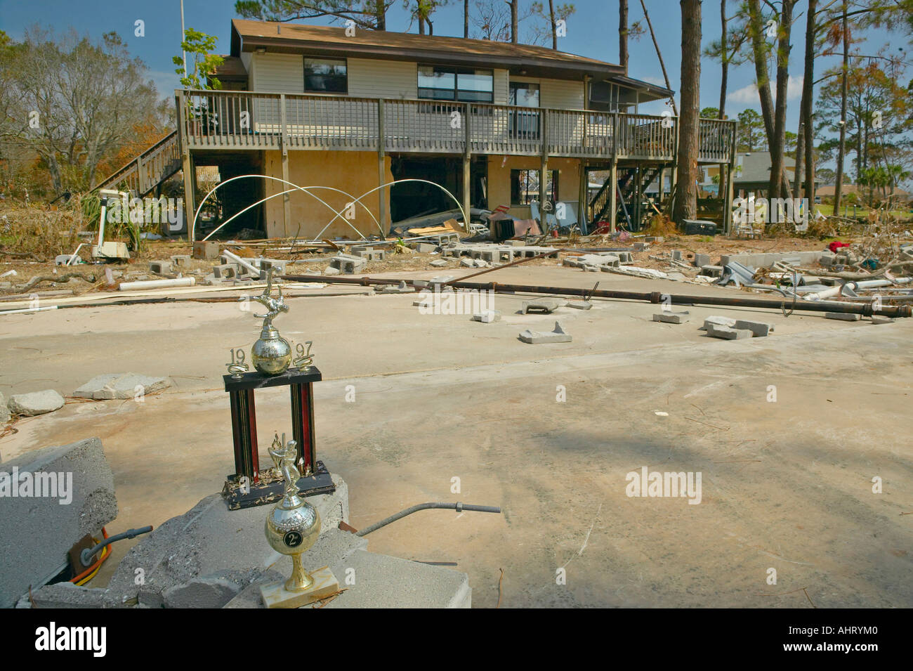 Baseball trophy and debris in front of house heavily hit by Hurricane ...