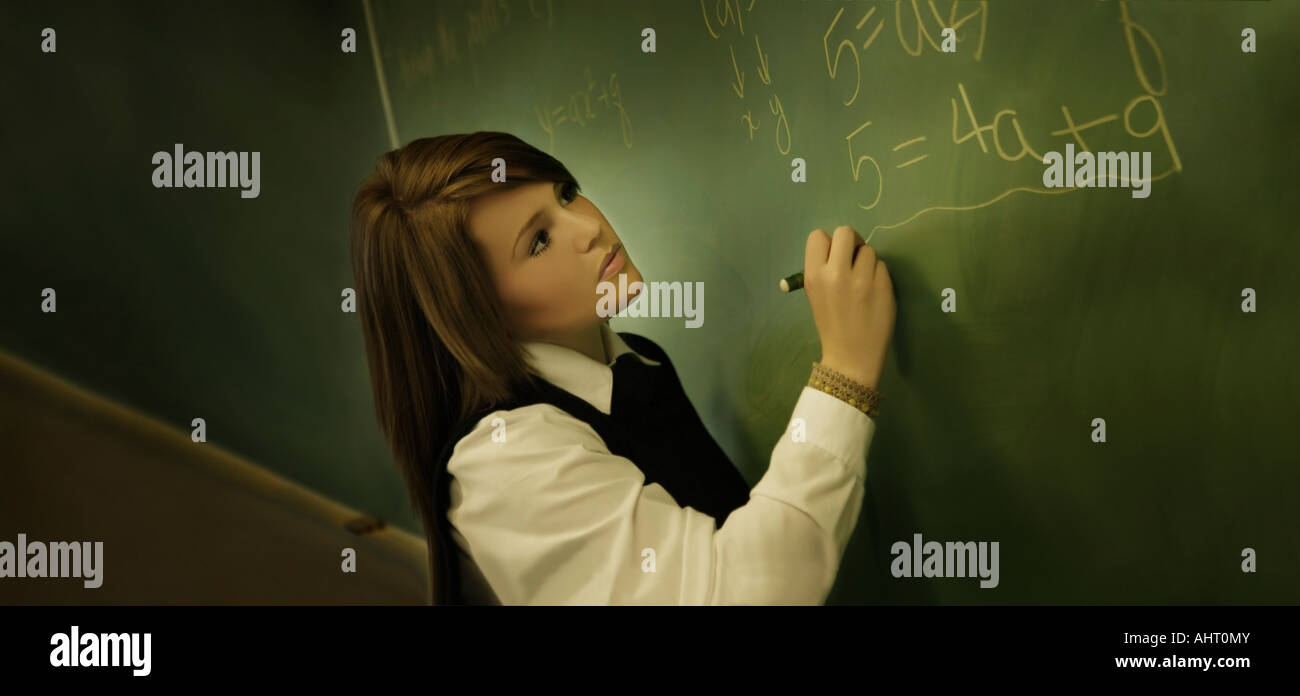 Female student in uniform writing on chalkboard Stock Photo Alamy