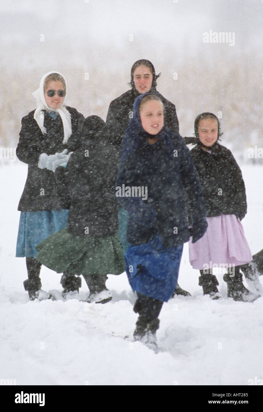 Amish girls play in the snow Shipshewana Indiana Stock Photo