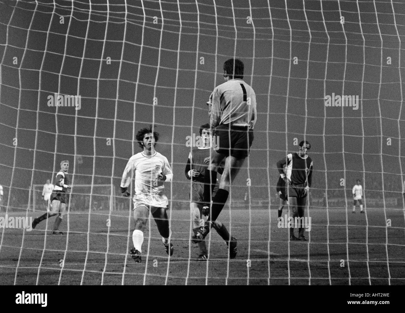 football, Bundesliga, 1970/1971, Niederrhein Stadium in Oberhausen, Rot-Weiss Oberhausen versus FC Bayern Munich 0:4, scene of the match, f.l.t.r. Gert Froehlich (OB), Gerd Mueller (FCB), Reiner Hollmann, keeper Wolfgang Scheid, Hermann Josef Wilbertz (al Stock Photo