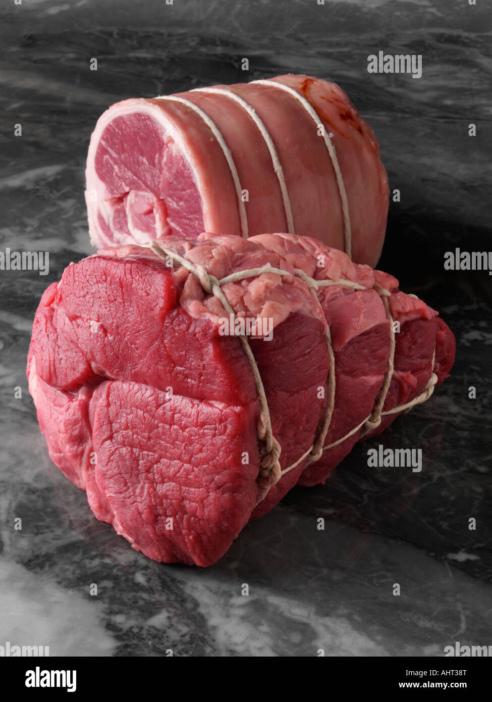 Raw Roasting joints of meat editorial food Stock Photo Alamy