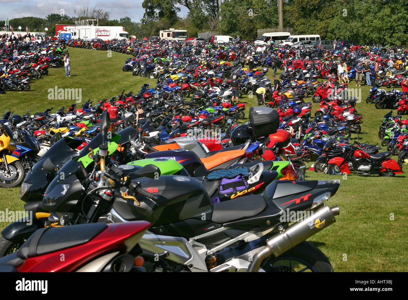 Large number of motor cycles parked in a field at the British 500 Superbike championship at Cadwell Park. Stock Photo