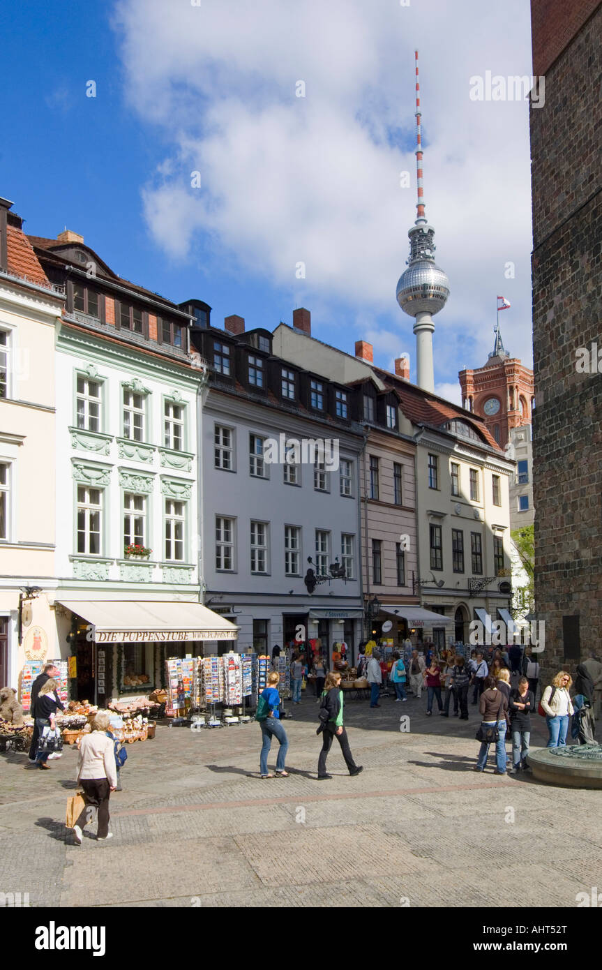 Tourists in the cobbled streets and area of The Nikolaiviertel or St. Nicholas Quarter with the TV tower in the background. Stock Photo