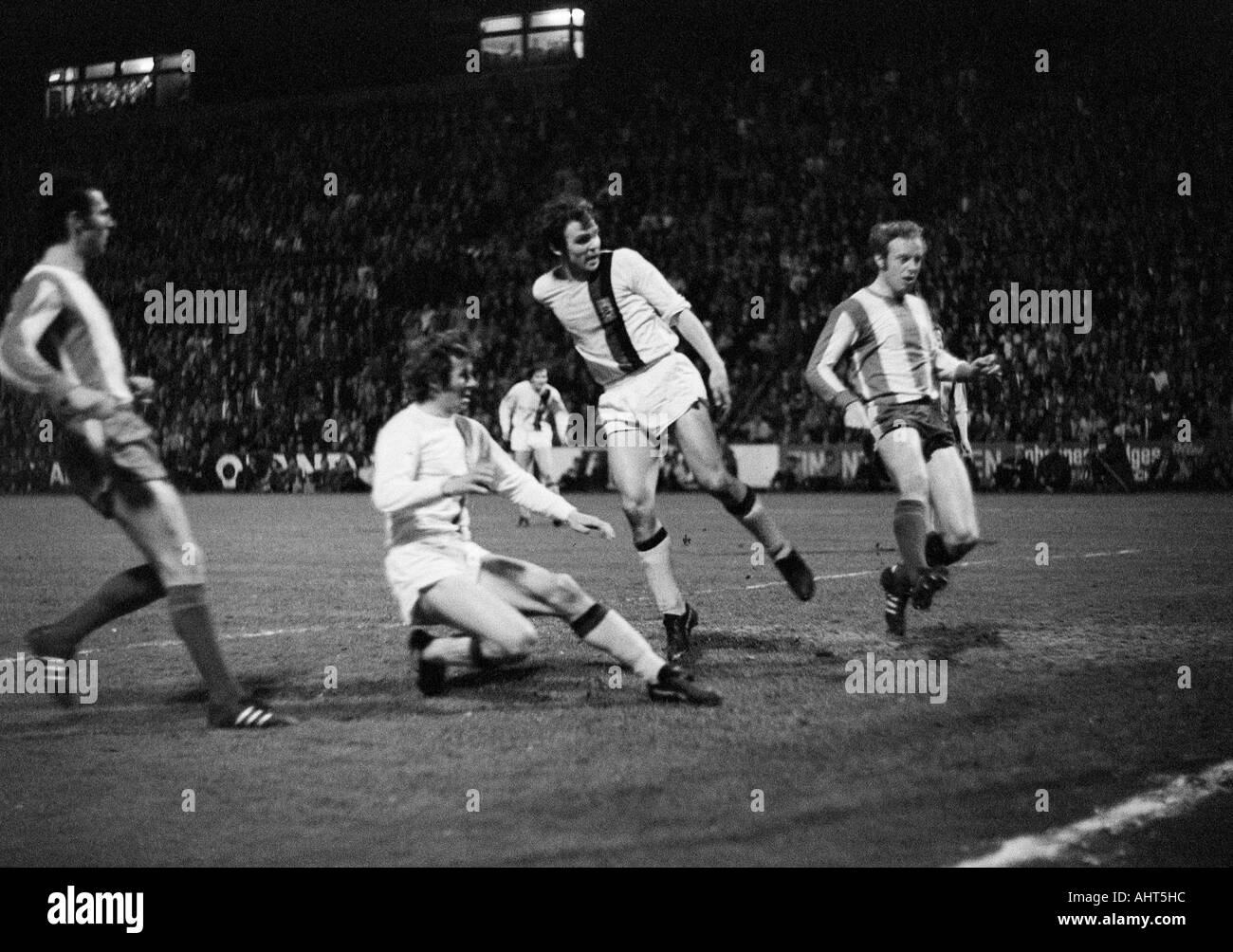 football, Bundesliga, 1970/1971, Borussia Moenchengladbach versus FC Bayern Munich 3:1, Boekelberg Stadium, scene of the match, 3:1 goal to Gladbach, f.l.t.r. Franz Beckenbauer (FCB), Rainer Bonhof, Ulrik le Fevre (behind), goal scorer Herbert Laumen (all Stock Photo