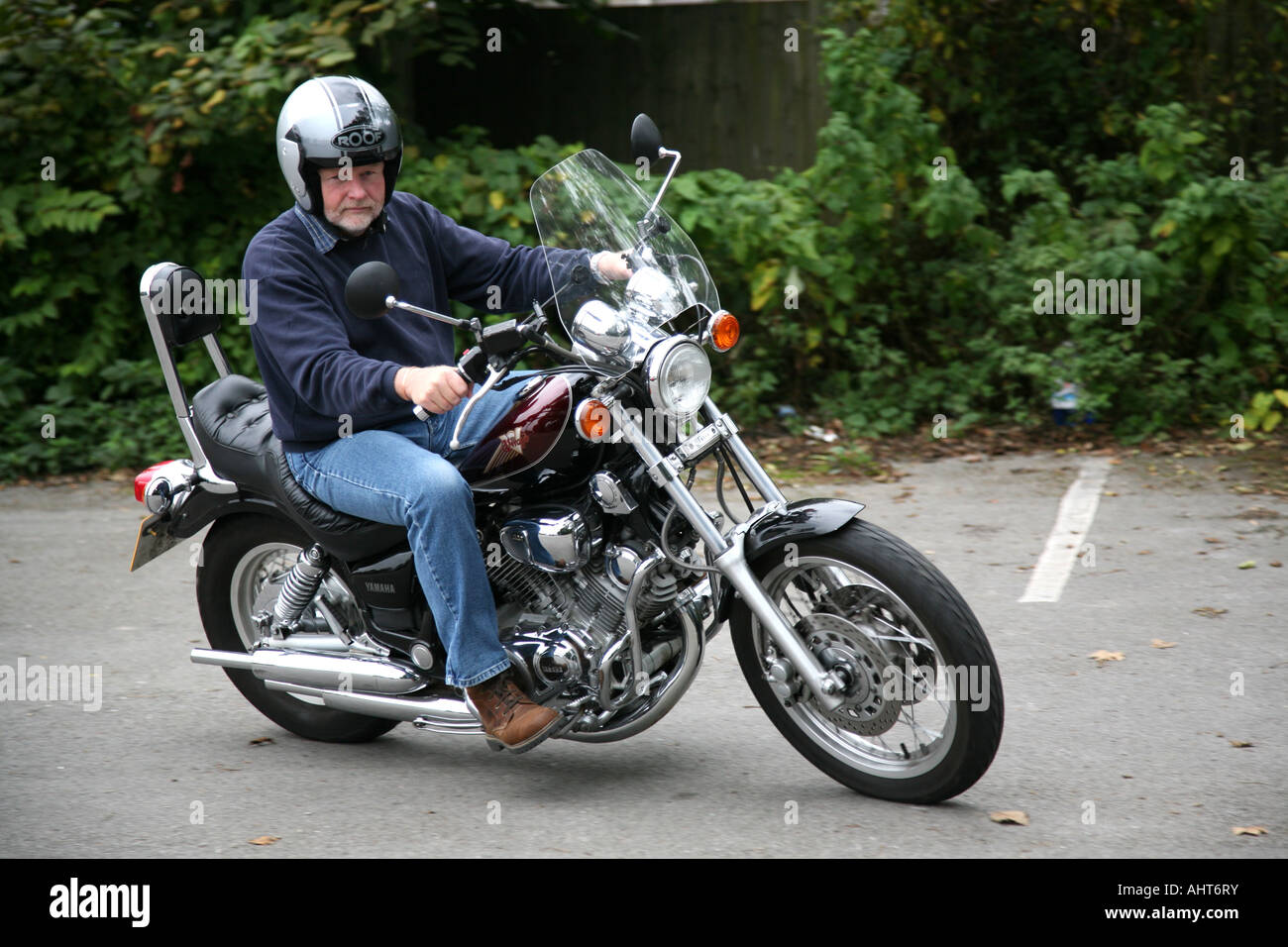 Man riding a Yamaha Virago 1100 Motorcycle. Stock Photo