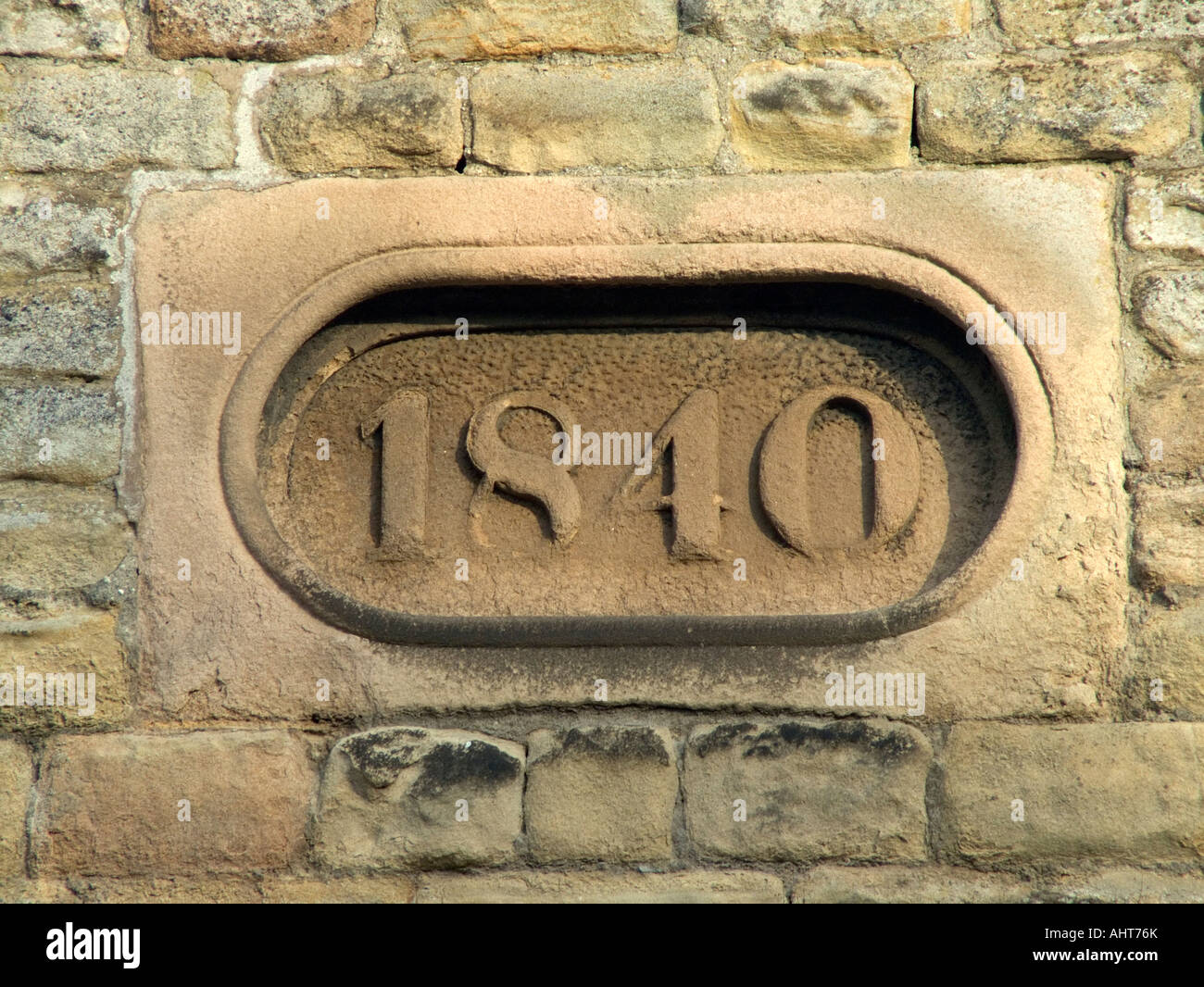 Date Stone of 1840 on the village school building in Rowsley in Derbyshire England Stock Photo