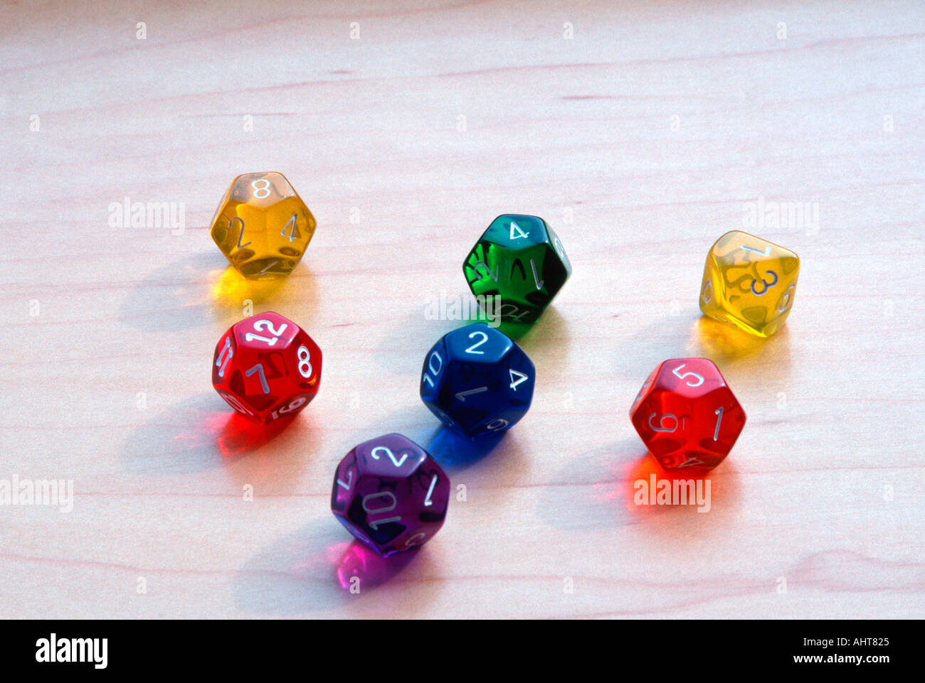Multi colored twelve sided dice Stock Photo