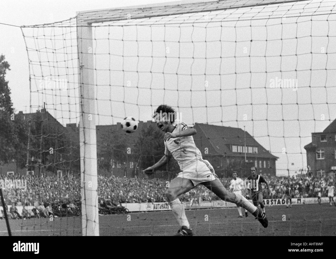 football, Bundesliga, 1971/1972, VfL Bochum versus Arminia Bielefeld 2:1, Stadium at the Castroper Strasse in Bochum, scene of the match, Hans Walitza (Bochum) misses a scoring chance, behind Werner Kraemer (Bochum) left and Gerd Knoth (Bielefeld) Stock Photo