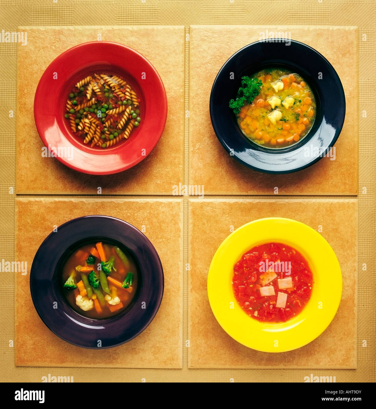 Four plates of different foods Stock Photo