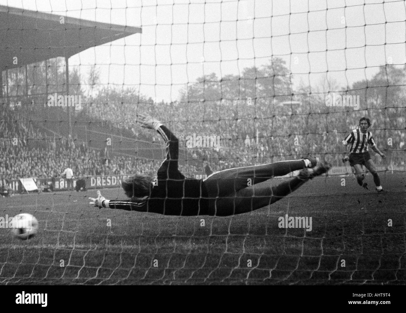 football, Bundesliga, 1971/1972, VfL Bochum versus 1. FC Cologne 1:5, Stadium at the Castroper Strasse in Bochum, scene of the match, 1:5 goal to Koeln by Wolfgang Overath (not pictured), keeper Hans Juergen Bradler (Bochum) is chanceless, right Heinz Flo Stock Photo