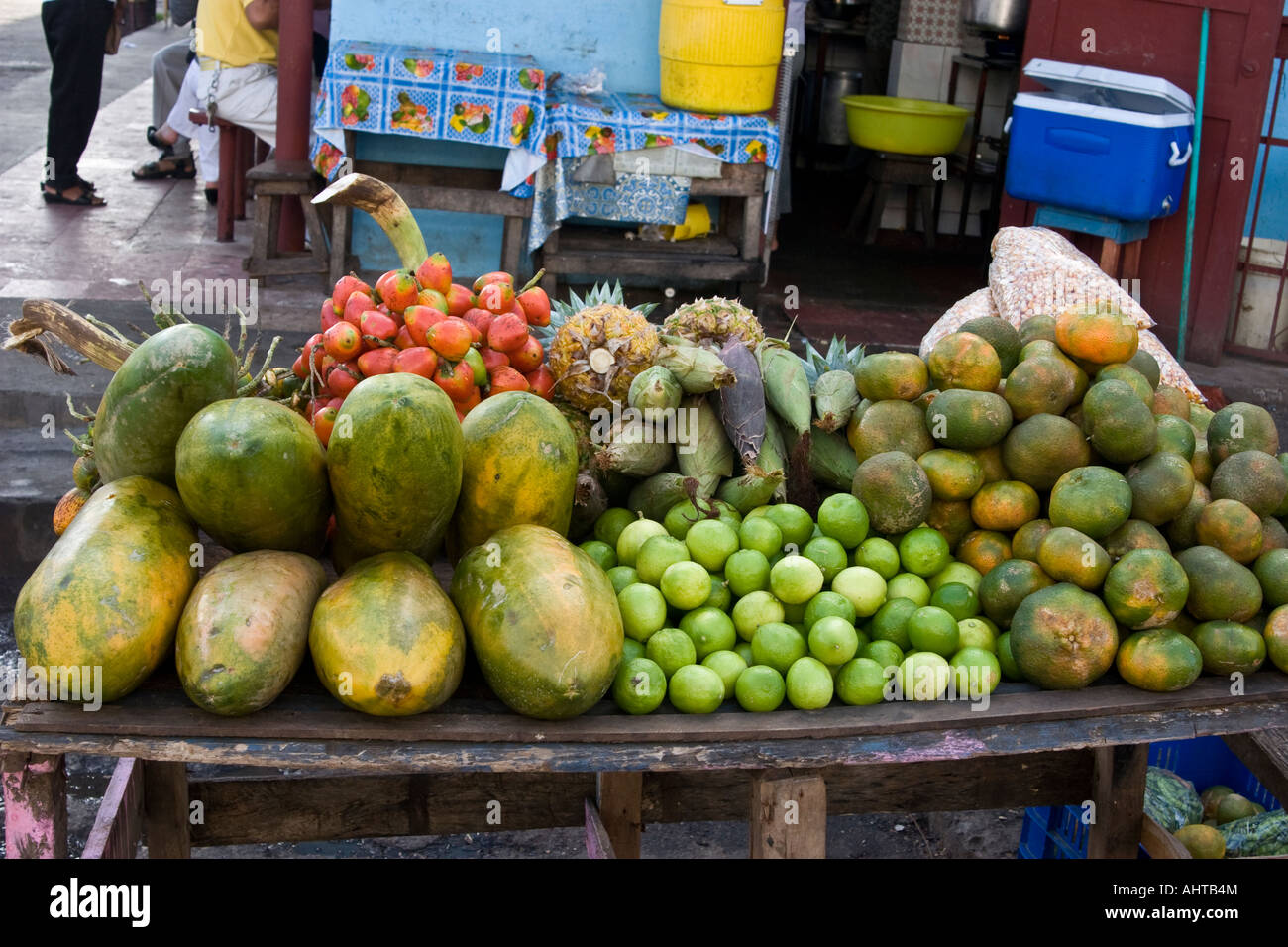 Papayas, pixbaes, mandarin oranges, pineapples and corn cobs for sale at El Mosquero, Santiago, Veraguas, Republic of Panama Stock Photo