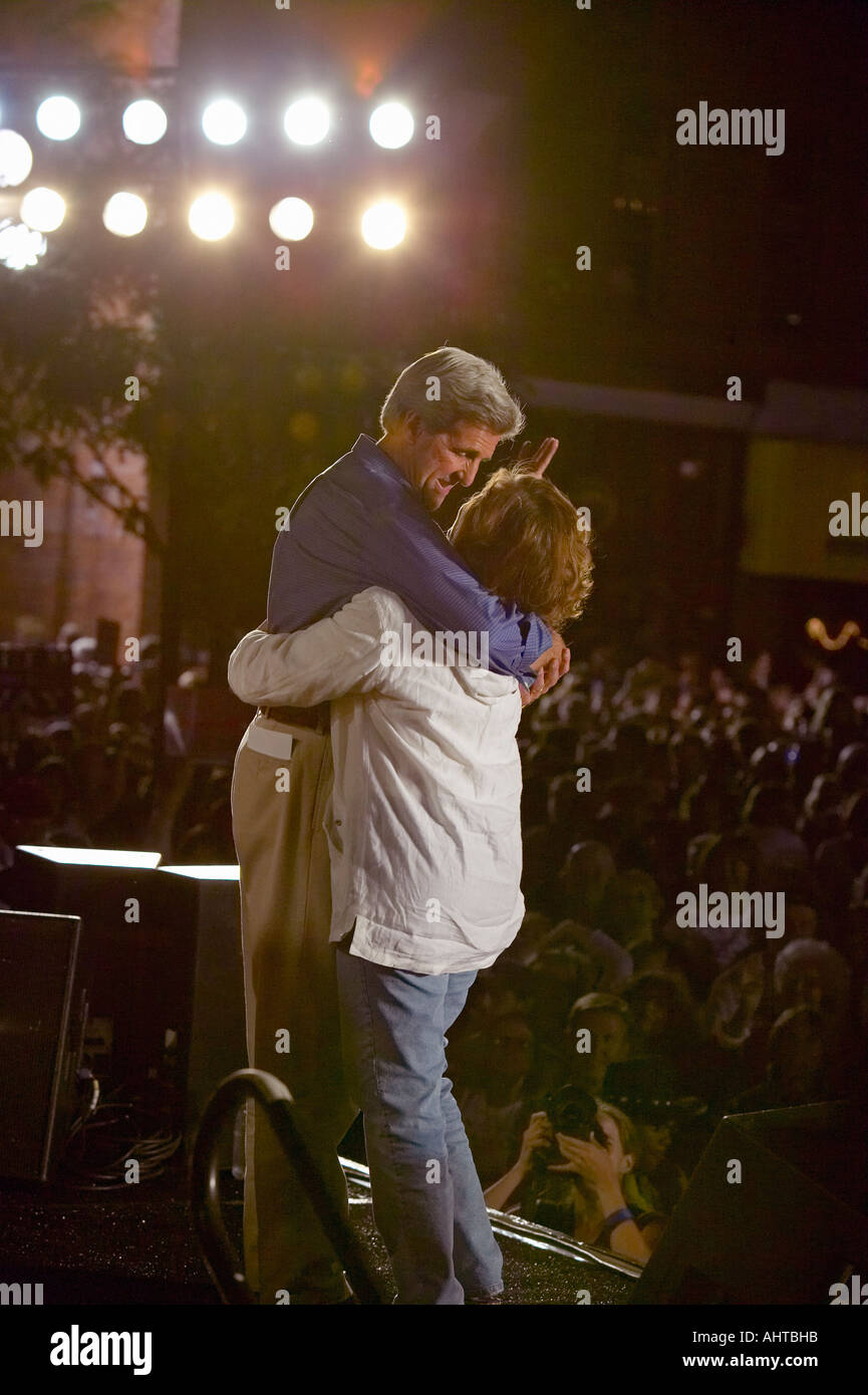 Senator and Mrs John Kerry embrace each other on stage at Heritage Square Flagstaff AZ Stock Photo