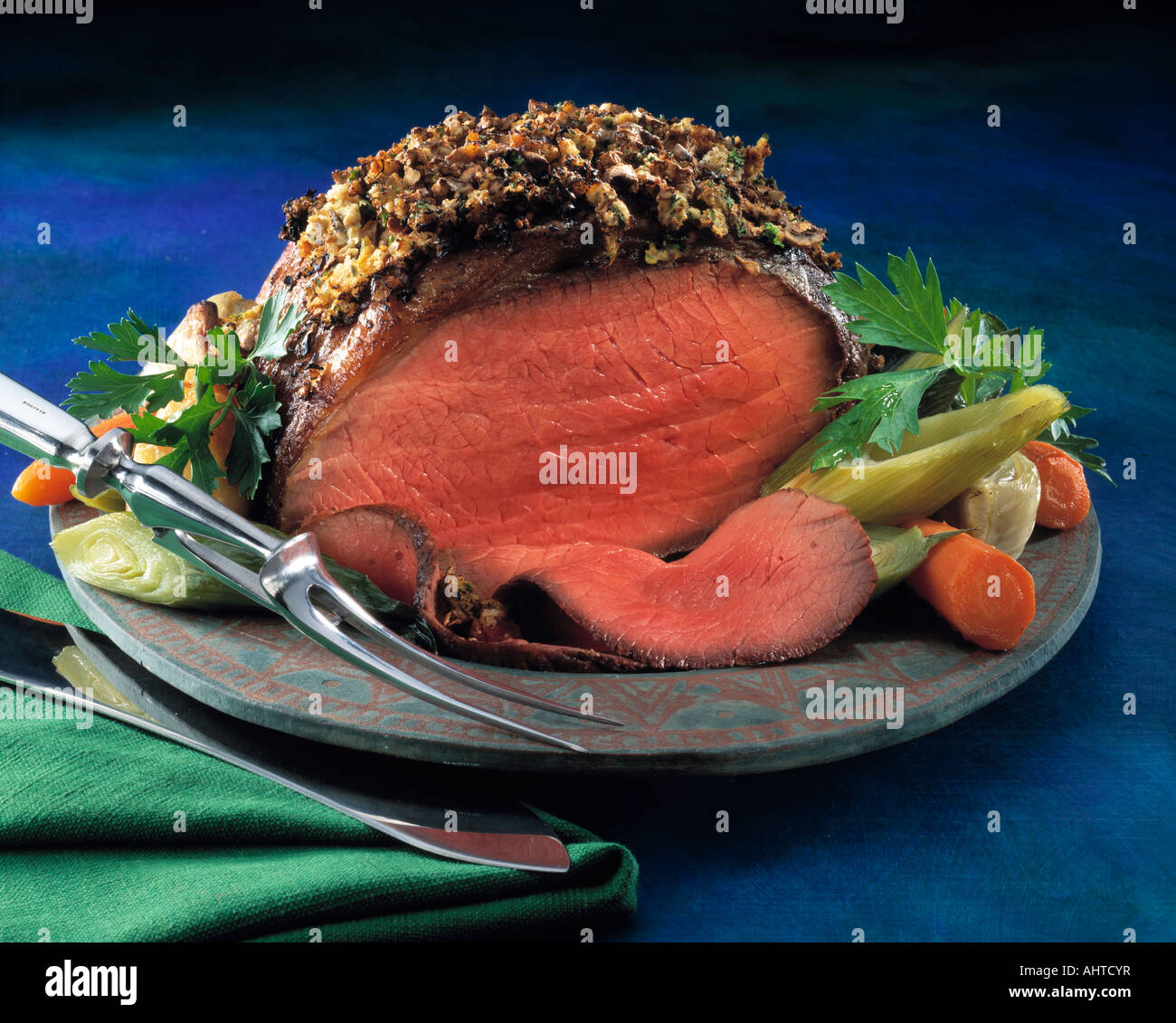 Roast beef joint with a herb crust editorial food Stock Photo Alamy