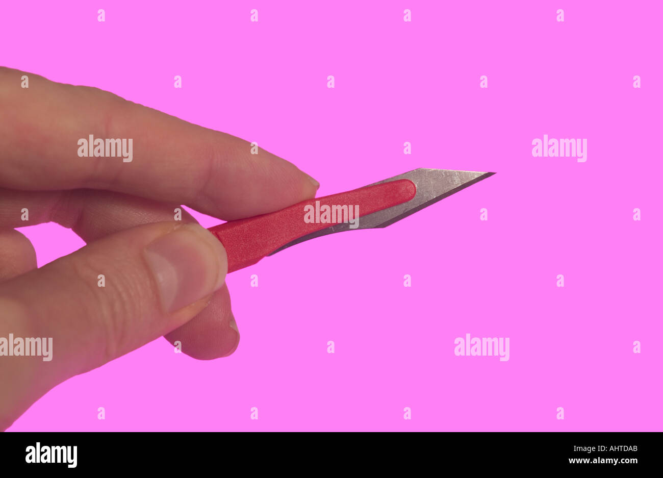 hand with scalpel Stock Photo Alamy