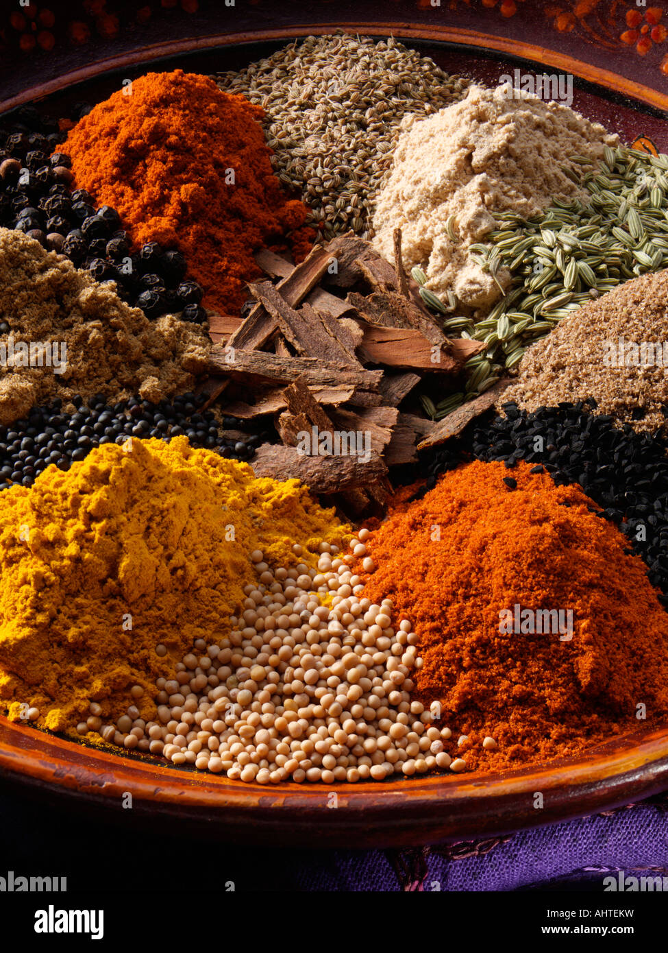 Indian spices piles cumin coriander chili turrmeric hires stock
