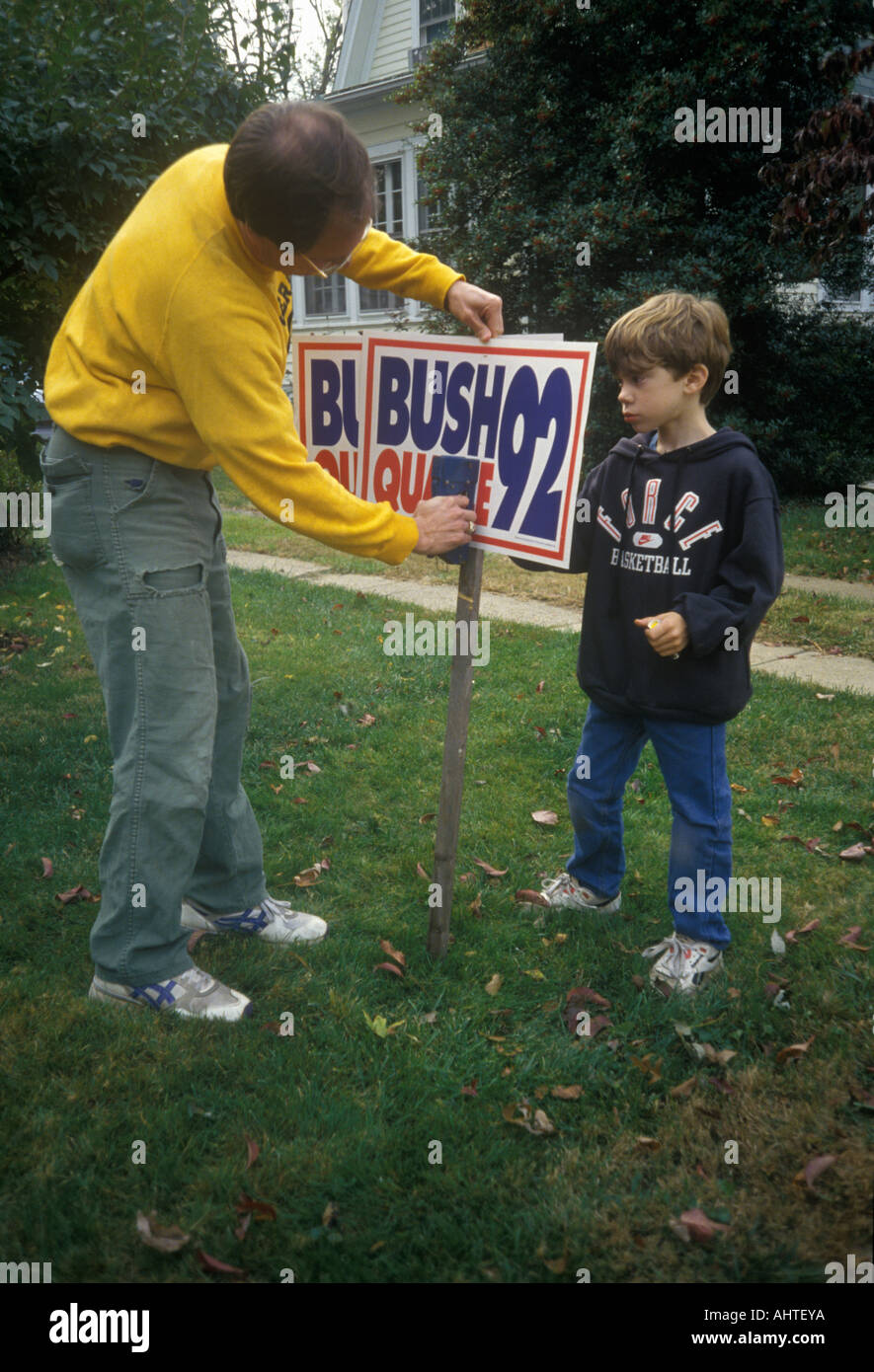 Man setting up Bush Quayle 1992 campaign sign in his yard Stock Photo