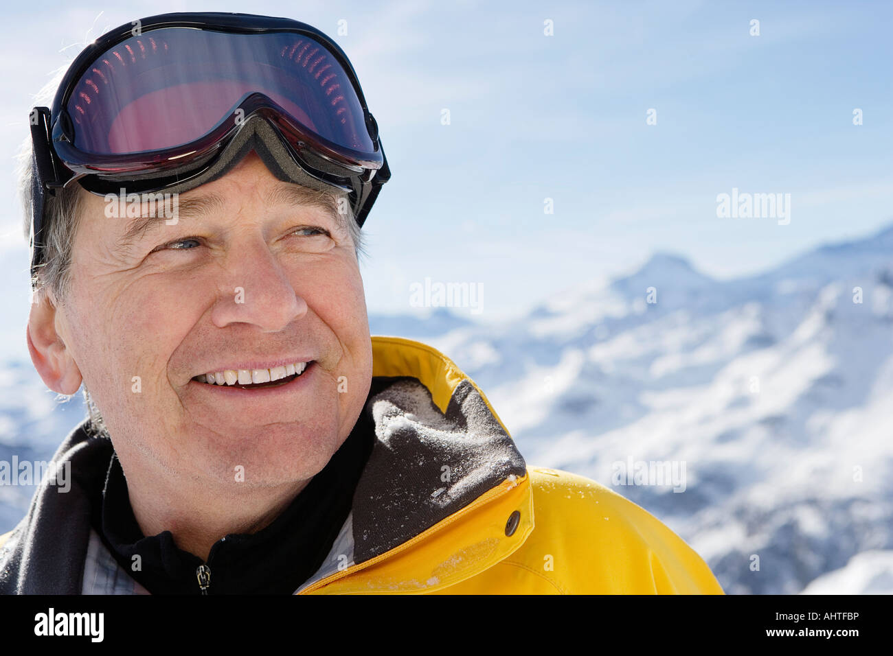 Mature male in ski-wear on mountain, close-up, portrait Stock Photo