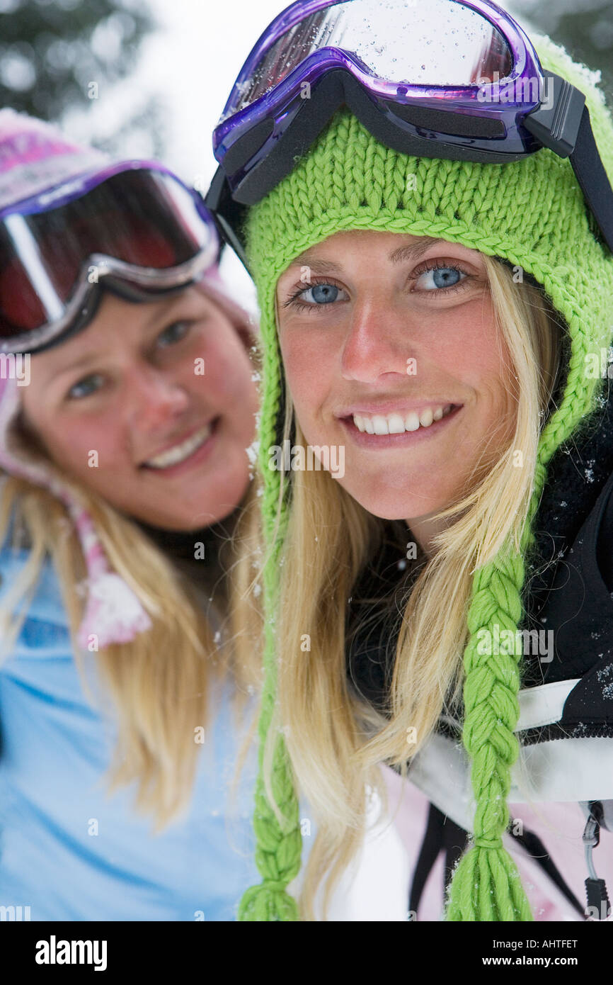 Close-up portrait of two young blonde women in ski-wear Stock Photo