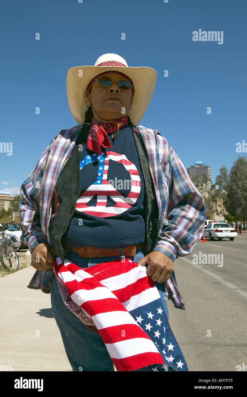 Woman with a Peace American t shirt protests President George W Bush in Tucson AZ at a political rally Stock Photo